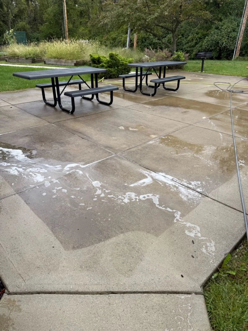 Patio cleaning around outdoor picnic tables